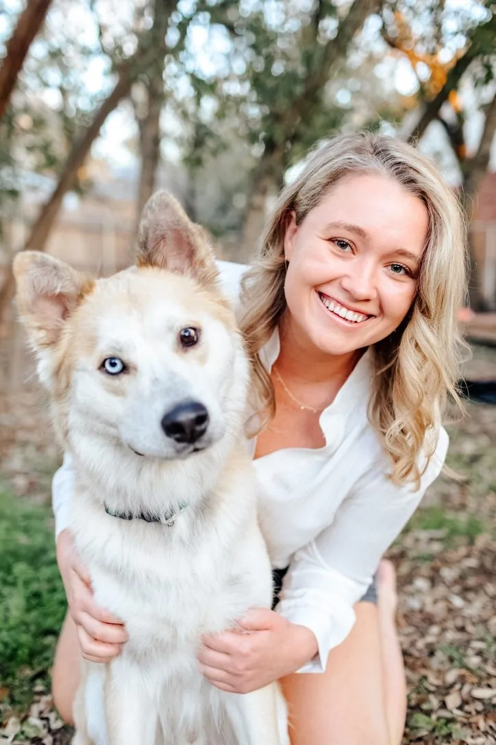 Merrik outdoors with her dog, Artimus