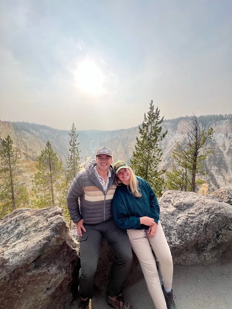 Merrik and her husband hiking in the mountains